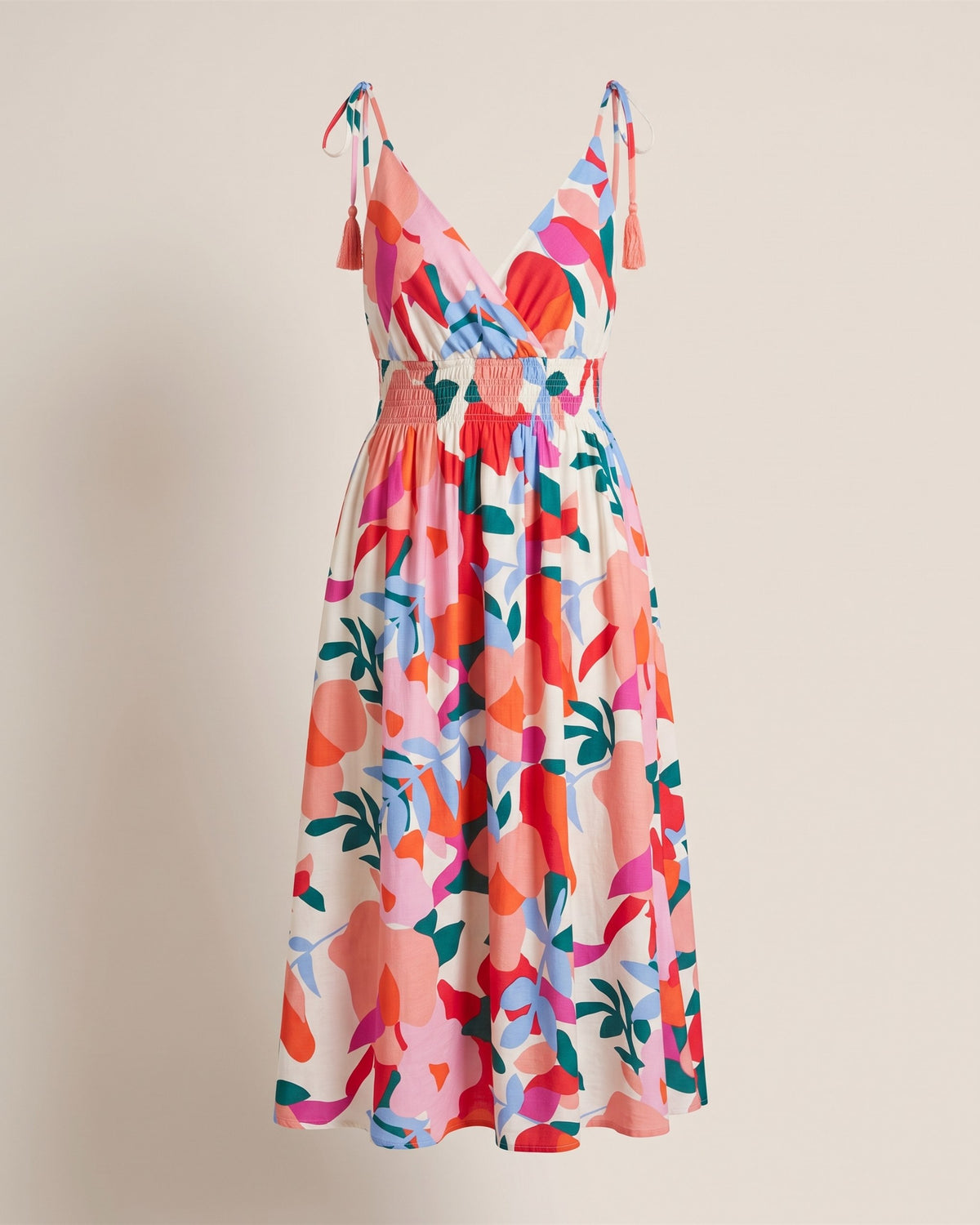 Robe Éclat fuchsia à bretelles nouées et imprimé abstrait, vue de face sur fond pierre