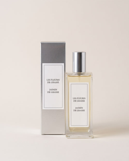 Vaporisateur d ambiance 100 ml Jasmin de Grasse avec son étui, vue de face sur fond pierre